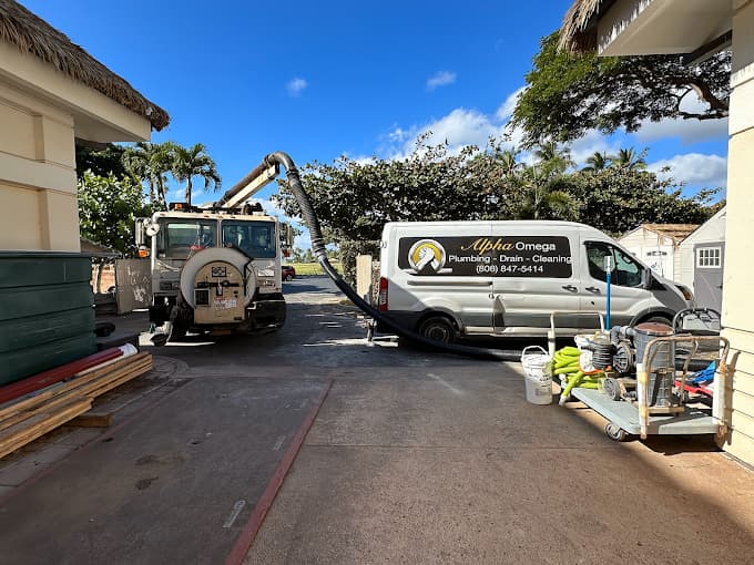Alpha Omega Plumbing service trucks that arrive on flat-rate plumbing jobs across O'ahu — Alpha Omega Plumbing