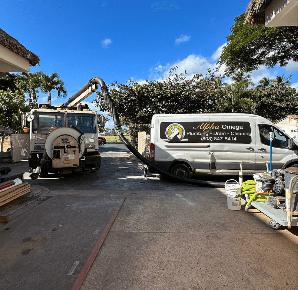 Alpha Omega Plumbing service fleet that delivers roll-off dumpster rentals across O'ahu — Alpha Omega Plumbing