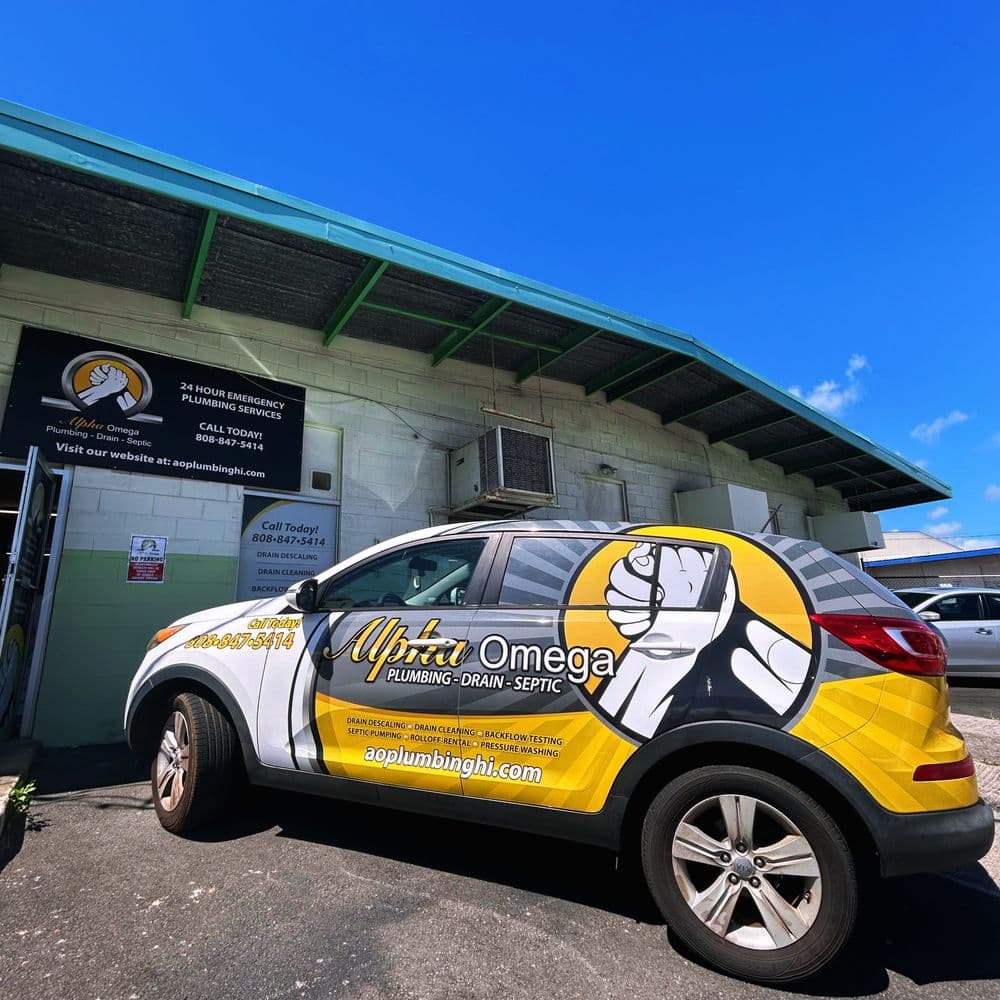 Alpha Omega Plumbing service vehicle parked outside the company's Honolulu shop, ready for an estimate visit — Alpha Omega Plumbing