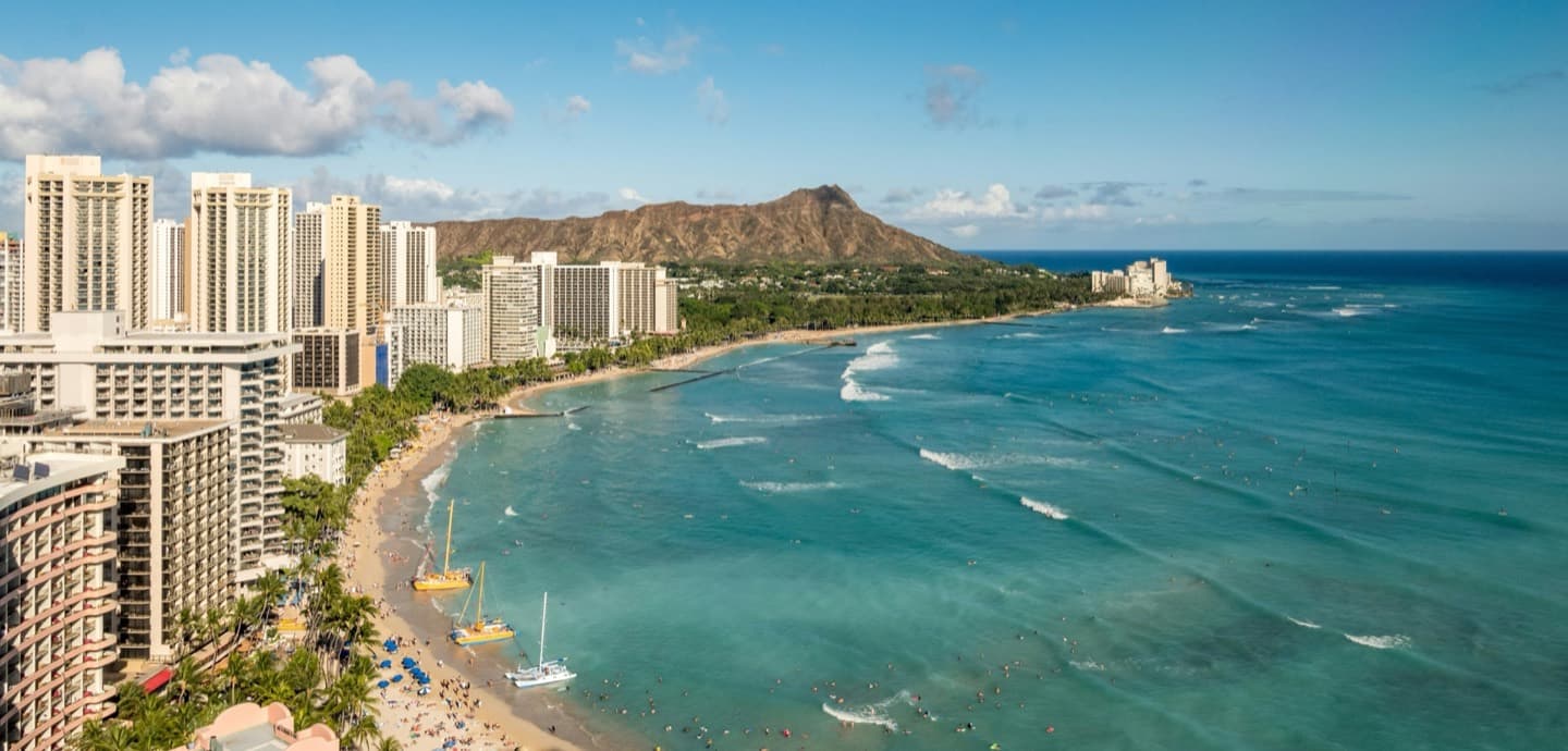 Honolulu shoreline below Diamond Head — the O'ahu neighborhoods served by Alpha Omega Plumbing since 2014