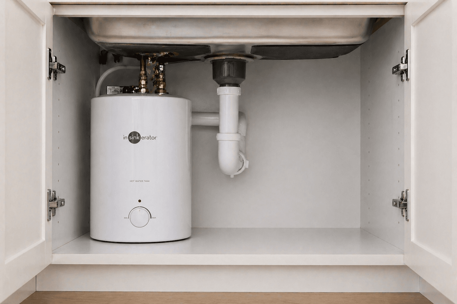 Checking a hot water supply line under a kitchen sink in an O'ahu home — Alpha Omega Plumbing