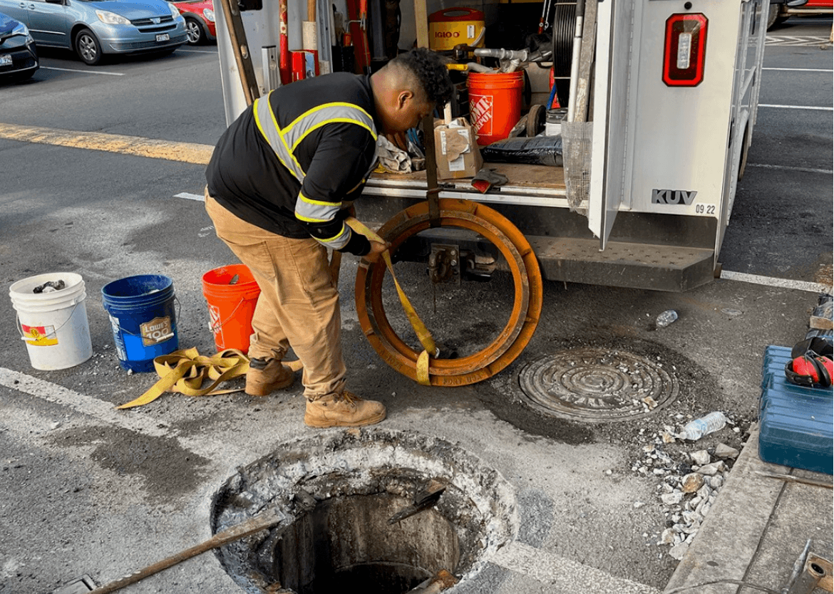 City and County sewer main access in a Honolulu street being opened for service — Alpha Omega Plumbing